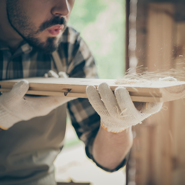 Expert kitchen craftsman sanding wood