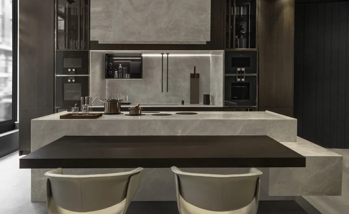 Italian vs German kitchens – Composit island Italian vs German kitchens compared: Composit stone island with dining bar at Brooklands Interiors Surrey showroom